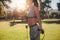 Sporty woman skipping in a park