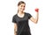 Sporty Woman Smiling While Flexing Muscle With Dumbbell