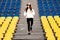 Sporty woman at the stadium on the stairs