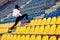 Sporty woman at the stadium on the stairs