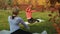 Sporty women doing fitness exercise in autumn park