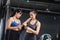 Sporty young asian women training boxer preparing strap on wrist with coach trainer