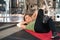 Sporty young woman doing sits-up at gym