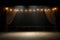 spotlight on empty stage with ballet barre