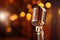 Spotlight on a retro microphone, stage with bokeh, music concept