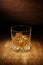 A spotlight on a single crystal glass of scotch whisky, shot on