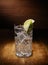 Spotlight on a single crystal glasses full of the Gin and tonic