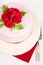 Spotted cake with red roses