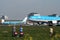 spotters spotting airplanes when takes off of at runway of schiphol
