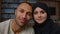 Spouses family multiracial diverse ethnicity couple man african american husband and arabian muslim woman wife smiling
