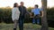 Spouses grandparents with kid on swing have good time on nature at weekend