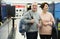 Spouses of mature age walk through the departments of the store