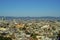 Sprawling cityscape with downtown city buildings and neighborhoods with houses in late afternoon sun in San Francisco