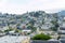 Sprawling cityscape of suburban San Francisco California on lightly foggy and cloudy day with suburban background