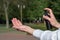 Spray antiseptic on hands close-up. Compliance with security measures. Girl in the Park