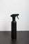 Spray bottle with antiseptic, black. For surface treatment against viruses. On a white background