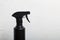 Spray bottle with antiseptic, black. For surface treatment against viruses. On a white background