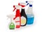 Spray bottles with different cleaning agents on a white background