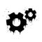 Spray painted graffiti of moving gears wheels in black over white. gear icon drip symbol