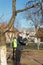 Spray pesticides, pesticide on fruit orchard. Defocus farmer man spraying tree with manual pesticide sprayer against