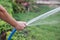 spray water to grass yard by rubber hose