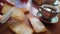 Spreading butter on a wheat cracker for breakfast with a knife