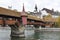 Spreuer Bridge is wooden bridge or footbridge with roof over river Reuss in Lucerne. Side view.