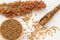 Sprig of sorghum, wheat in a wooden spoon buckwheat in box