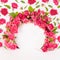 Spring abstract stage - framing of round arch of pink spray roses mockup with levitation of buds and green leaves as pattern.