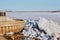 Spring on the Amur River. Ice drift. Pier city embankment. A large pile of ice blocks. River port of the city of