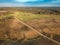 Spring arable land. A field and road. View from above.