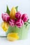 Spring arrangement of pink and yellow tulips