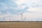 Spring or autumnal landscape with windmills on fields. Polish countryside with windmills.