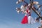 Spring background with blossom and Bulgarian symbol of spring martenitsa. March 1 tradition martisor and spring flowers