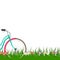 Spring background with a woman bike on grass with flowers