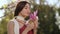 Spring Beauty Portrait of a Woman with Flower Outdoors