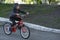 Spring bike ride. boy learning to ride a bicycle. Child rides Bicycle on paved road