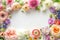 Spring blooms. Floral frame from pastel flowers on white background