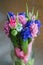 Spring boquet of flowers in vase on postcard