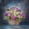 Spring bouquet. Lily of the valley and lilac in a basket