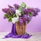 Spring bouquet. Lily of the valley and lilac in a vase