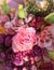 Spring bouquet of mixed colorful flowers. Flowers bouquet including pink hamelacum, pink Eustoma, pink spray rose, pink hypericum