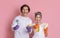 Spring Cleaning. Cheerful Millennnial Couple Posing With Household Tools In Hands