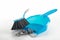 Spring cleaning concept, blue hand brush and dustpan sweeping du