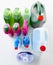 Spring-cleaning essentials. Studio shot of various bottles of detergents against a grey background.