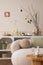 Spring composition of easter living room interior with mock up poster frame, modern sideboard, coffee table easter eggs, round