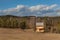 Spring on the construction of ecological buildings. Unfinished wooden house on the edge of the forest. Spring weather in the Czech