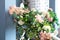 Spring decoration of handrails stairs porch in the house. staircase railings decorated spring flowers and twigs plants leaves