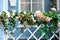 Spring decoration of handrails stairs porch in the house. staircase railings decorated spring flowers and twigs plants leaves.