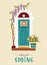 Spring or Easter concept. Decorated vintage entrance door with wisteria, tulips and spring wreath. Traditional spring home